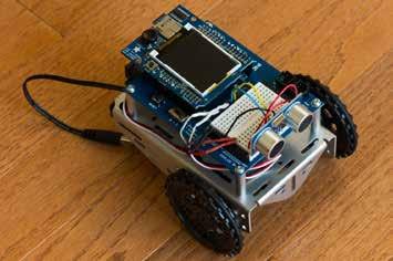 Figure 3: Boe-Bot Robot Kit with Arduino Uno board, ultrasonic range finder, and LCD screen. LED blink, up to obstacle avoidance using an ultrasonic range finder [6].