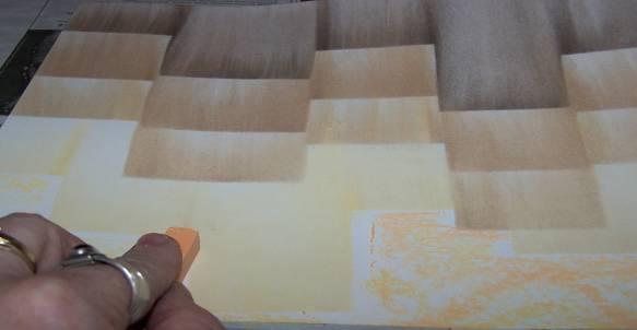 Find a clean spot on the paper towel so that you can push the pastel up to the bottom of the last