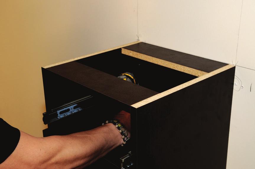 Measure the distance from the outer edge of the first base cabinet to the center of the studs you wish to