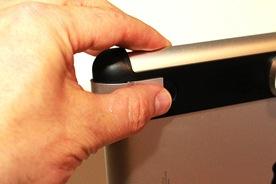 around the ipad camera, close the latch by pressing down on it
