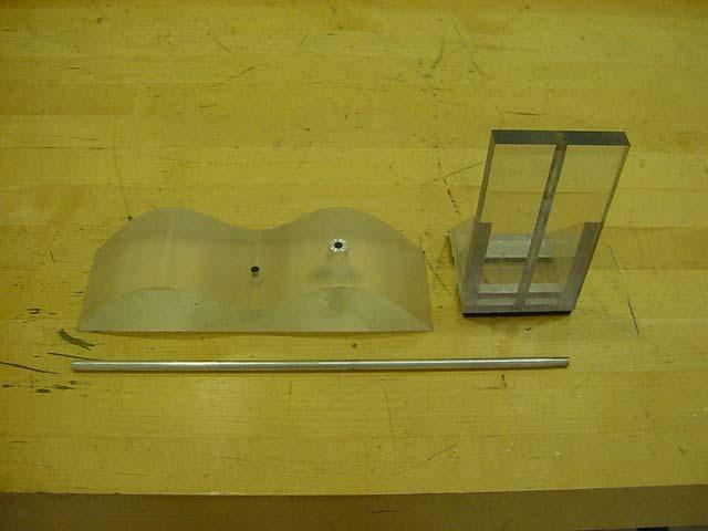 Figure 3: obstacles with hook wave (top left), wall (top right), pipe/hook (bottom) The basic structure consists of the wall, base, and two triangular supports all made with polycarbonate.