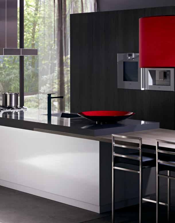 this sophisticated essastone kitchen is the ultimate entertainer. Bold splashes of red complement the intensity of the essastone island bench worktop in French Black.