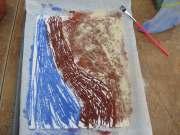 Materials: Bags of colored sand White craft glue 8 X 11 piece of poster board or a paper plate An old cooking sheet or tray A cup or can for excess sand Procedure: Place poster board in the tray.