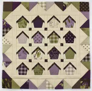 Finish Quilt: Sew a button to the center of each birdhouse. Then layer the quilt top with batting and backing fabric.