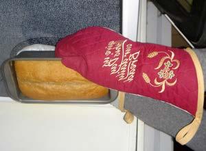 Embroidered Oven Mitts Whether it's a loaf of bread, a Thanksgiving turkey, a birthday cake, or a rack of ribs on the grill, oven mitts are a must for