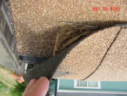 The underlayment is incorrectly installed over shingles.