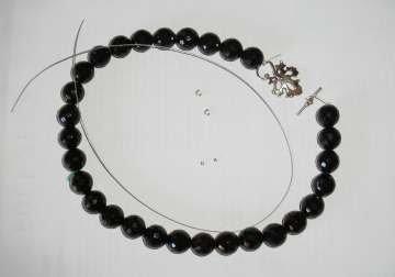 Step 1 Gather Supplies 1 strand of Onyx beads (I used faceted round in about 12mm, about a 16 inch strand) 1 length of flexible beading wire, enough for your necklace plus several extra inches to