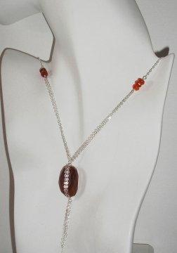 Carnelian Nugget Pendant About This Design Time: Approximately 2-3 hours Level of Difficulty: All Levels (with Basic Wire Wrapping Knowledge) Cost: Varies, depending on materials selected.
