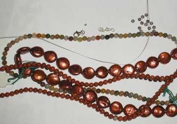 Step 1 Gather your supplies 8 coin pearl beads Enough jasper beads to fit your desired bracelet length for two strands Silver daisy spacer (Bali) beads (about 18-20) 4 silver crimp beads (2 each
