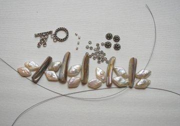 Step 1 Gather your supplies. Here's what you'll need. One strands of freshwater pearls. I used diamond shape pearls but any pearls will work. Five or six double hole beads or spacer bars.