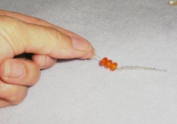 Step 3 Add carnelian beads and attach to earrings Slide the