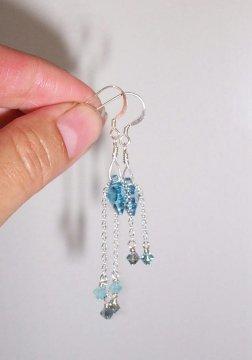 Slide a crystal bead onto a headpin, and attach the crystal to the chain using a closed loop.