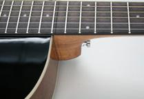 Fingerboard and Bridge Traditional Dot Inlay in Prewar-style staggered sizes Compensated Saddle Distinctive