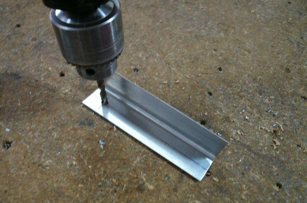 Cut one L Angle 82mm long and another 110mm long. Mark the center line on one flange of each L Angle.