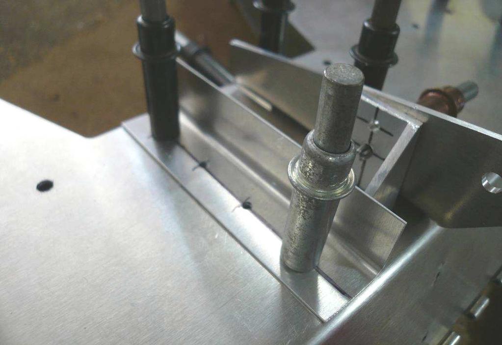 Use a #40 drill bit to drill the rivet locations. Expand the aft most hole with a #20 drill bit.