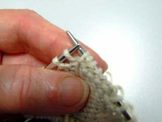 Place tip of LN in back of loop of SPR. Wrap yarn as to purl (fig C). Purl SPR, using the LN to assist you.