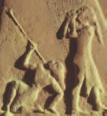 2 Two enemy soldiers confront the Akkadian king, one begging for mercy and another, mortally wounded, attempting to pull an arrow from his neck.