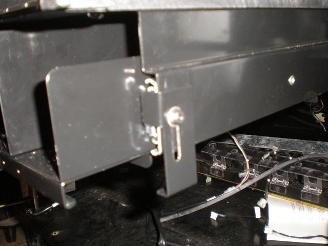 To pull out the tray, the locking mechanism will need to be pushed up while pulling it out.