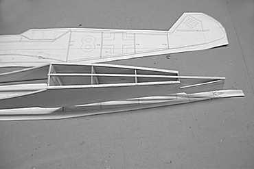 Add the 1/8" balsa stringer to the lower rear fuselage. Add 1/4" balsa blocking to the forward fuselage to allow for sanding to a rounded shape.