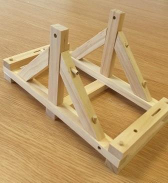 using an A frame where you have two beams connecting at a 45⁰ angle.