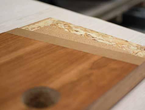 Below: Veneer is the thinly sliced layer of wood that is usually glued to a layer of fiberboard and then adhered to each side of a structural wood core, creating a five-layer sandwich that is cured