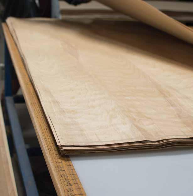 Rotary-cut natural birch veneer is inspected and sorted. Preferences in veneer selection can usually be predicted using the Mason-Dixon line.
