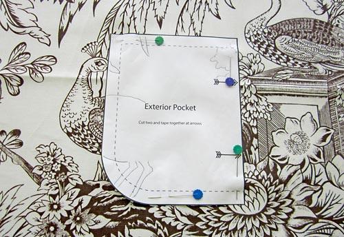 6. Find the other pocket template you printed. Flip it over and tape it to the pinned template. Pin this half of the template in place. 7. Cut out the entire exterior pocket.