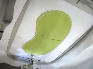overlap slightly). Attach the hoop back onto the machine and continue embroidering the design.