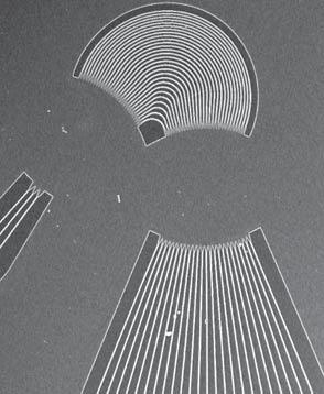 Scanning electron micrograph of fabricated AWG and near-field patterns of output light for different λ s. 0 Relative Transmission [db] 10 20 30 1.50 1.55 Wavelength [μm] 1.60 Fig. 4.