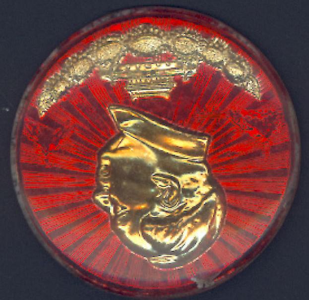 Mr. Klus' small collection of Mao Pins plastic pin. Red field with raised gold profile of Mao at center. Red field has lines radiating from Mao.