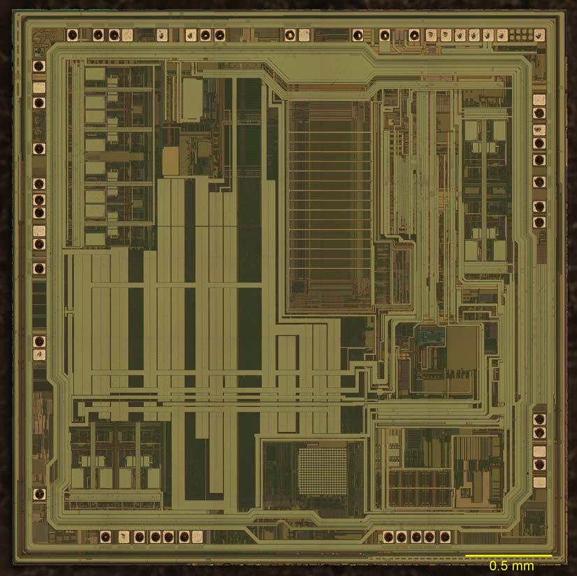Device Identification 3-4 3.2 Die Figure 3.2.1 shows a photograph of the die. The die is 3.15 mm x 3.15 mm as measured from the die seals, or 3.18 mm x 3.18 mm for the whole die.