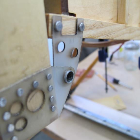 You can test fit the wooden frame in place onto the fuselage ensuring the mount brackets align to the radiator bracket #1.6 on the bottom fuselage longeron.