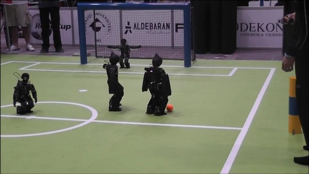 The proposed approach conceived the team as a self-organizing strategy-based decision making system, in which the robots are able to perform a dynamic switching of roles in the soccer
