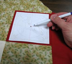 Using embroidery software, create a paper template of the design by printing it at full size.