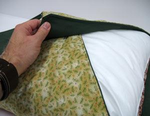 Lay the fabric flat and lay the pillow form over the pillow sham.