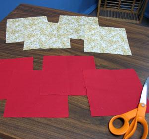 solid-colored quilter's cotton and four 6 1/2 x 6 1/2 inch squares