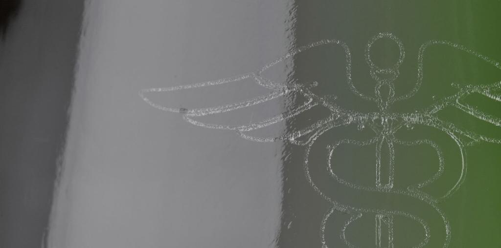 Marking effects: Logo detail on glass Micro cracks/fracturing that etches into the glass surface Mark