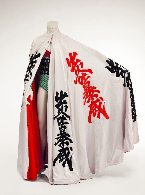 Cloak decorated with kanji characters and asymmetric knitted bodysuit, 1973.