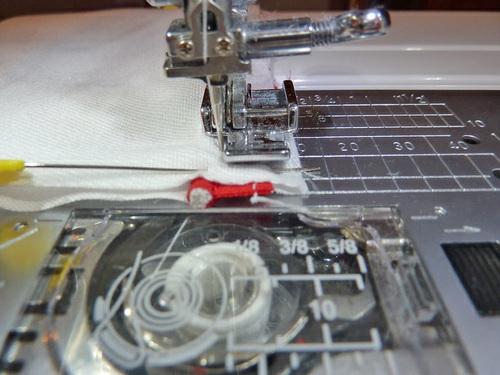 If you measured correctly when pinning, this ½" seam should stitch right along the piping cord. 5.