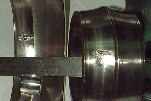 Figure 6: Photograph of defective service water pump bearing, showing inner and outer race spalling.
