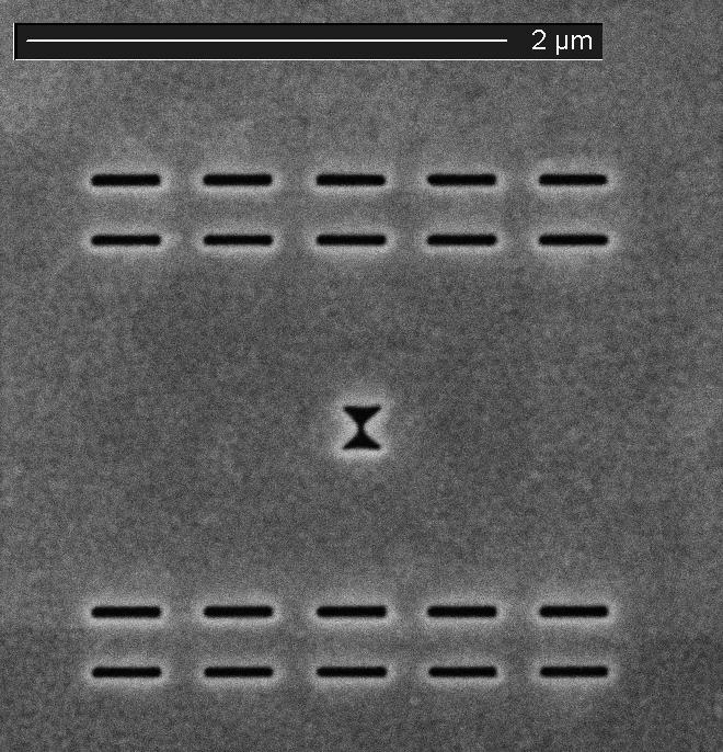 Fig. 7.1: SEM image of the nano-slits and bowtie aperture Fig. 7.2 shows the power output of a VCSEL before opening either slits or nano-aperture, after only opening twenty 50 280nm 2 slits and after adding the bowtie aperture respectively.