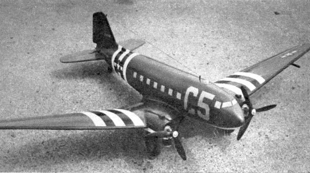 The model In full dress. WW II invasion stripes and the AAF stars are easily applied decorations which provide a colorful craft.