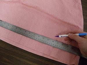 Remove the templates. Use an air-erase pen or other marking tool, and mark up that measurement (ours is three inches) periodically along the fabric.