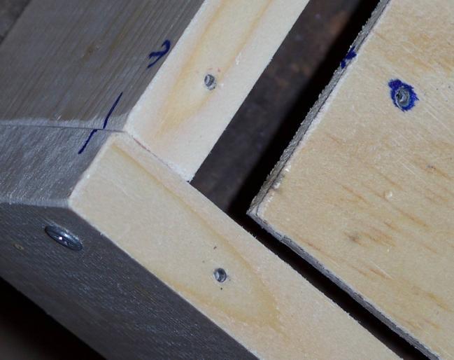 Remove the screws, flip the plywood over, and drill through the existing holes again into