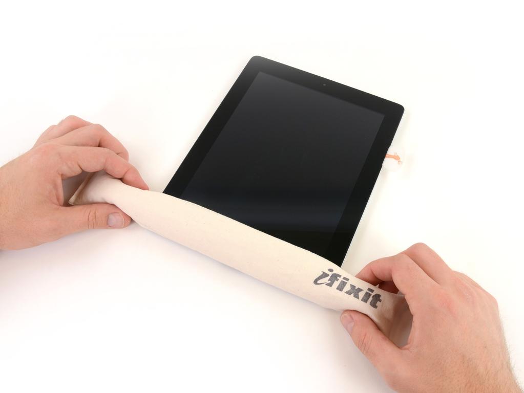 Step 10 While you work on releasing the adhesive on the right side of the ipad, reheat the iopener, and replace it on