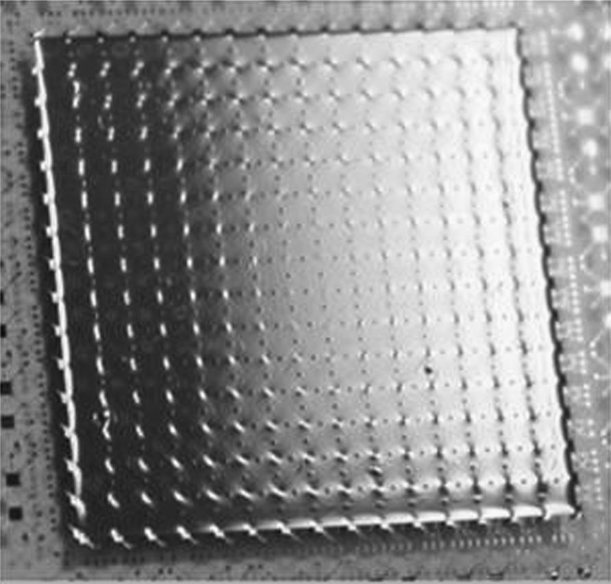Wavefront Correctors 145 FIGuRE 8.41 High-stroke, high-order MEMS deformable mirror fabricated in a high-aspect-ratio micromachining process.