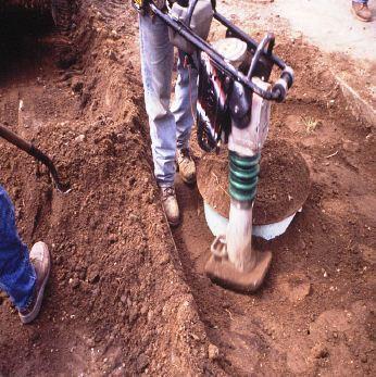 The Contractor must have the proper operating compaction equipment on the site before any of the excavation has begun. A mechanical tamper is usually used in this type of work.