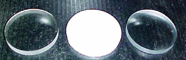 from Trivex and CR-39 materials did not register any change in weight, diameter or clarity. The polycarbonate lenses turned solid white after being soaked in acetone as shown in the photograph.