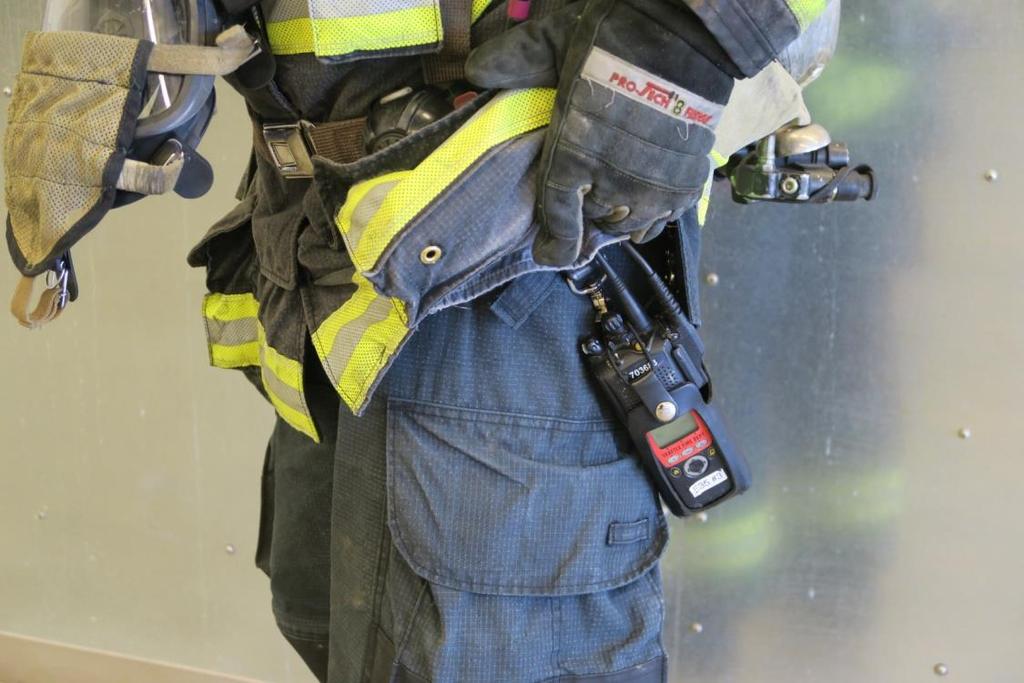 Firefighters who carry the radios like this claim they have no problem accessing their: Radio unit Hand-held mic Volume control knob, Channel selector knob Switching to