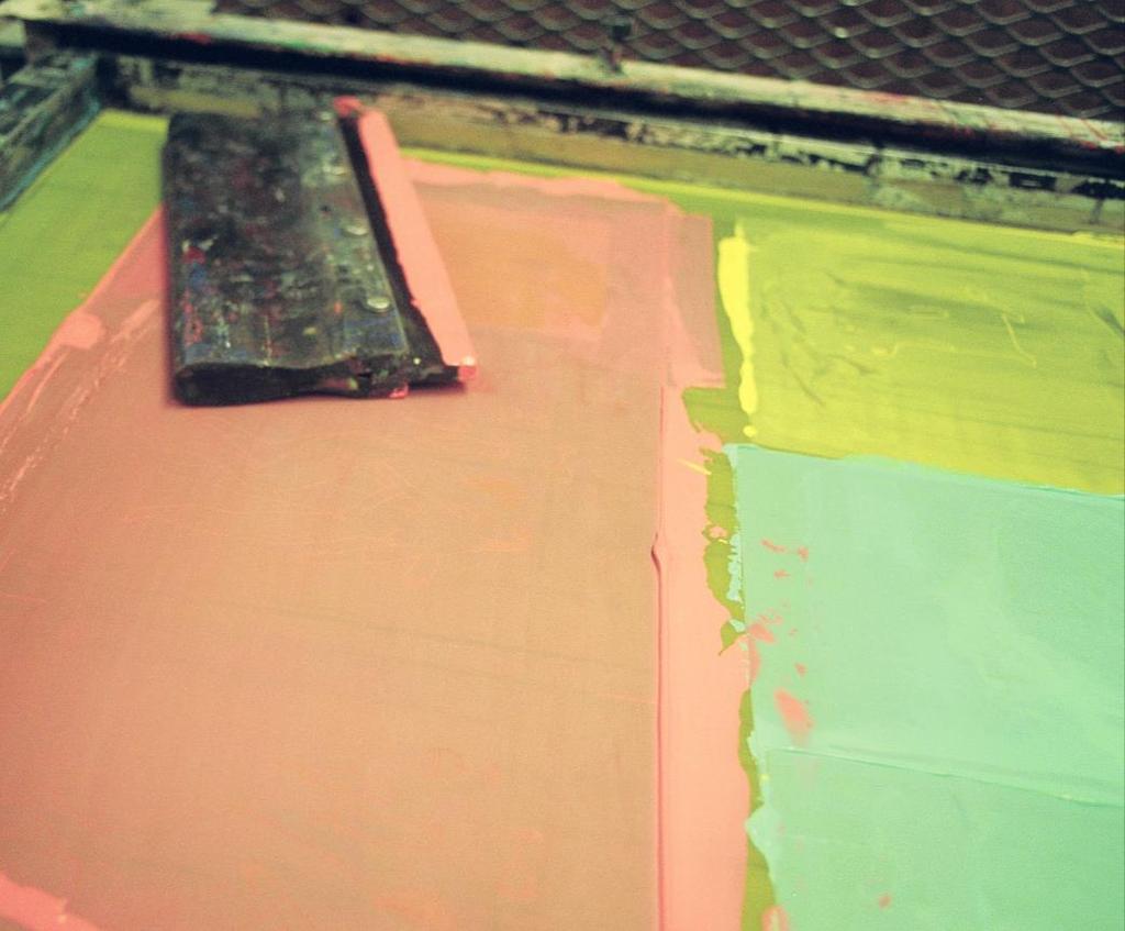 Screen printing: uses reverse artwork and mesh screens developed for each color to apply